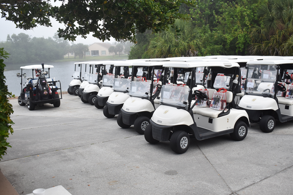 Golf carts line up at the Women in Defense Space Coast 7th Annual Sandbagger Invitational Golf Tournament