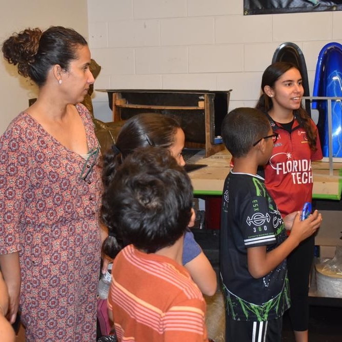 A young woman speaks up during WID Space Coast's tour of Florida Tech