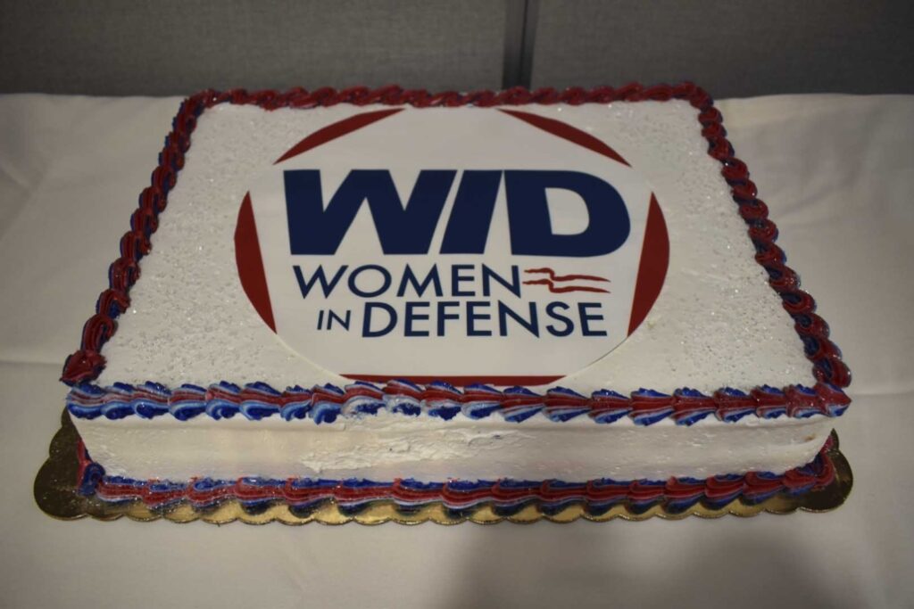 The WID logo is featured on a cake.